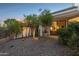 Backyard area featuring rock landscaping, desert flora and a covered back patio at 9265 N 115Th St, Scottsdale, AZ 85259