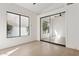 Bedroom with light floors and a window is fitted with a closet with mirrored sliding doors at 9265 N 115Th St, Scottsdale, AZ 85259