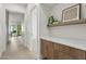 Hallway with wood floors, leading past a built-in storage area with decorative shelf elements at 9265 N 115Th St, Scottsdale, AZ 85259