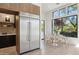 Open kitchen view with stainless steel refrigerator and a bright breakfast nook at 9265 N 115Th St, Scottsdale, AZ 85259