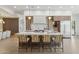 Modern kitchen featuring a large island with barstool seating and pendant lighting at 9265 N 115Th St, Scottsdale, AZ 85259