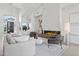 Bright living room featuring a sleek fireplace, high ceilings, and ample natural light at 9265 N 115Th St, Scottsdale, AZ 85259