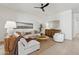 Comfortable living room with a plush sectional, natural light, and tasteful decor, ideal for relaxation at 9265 N 115Th St, Scottsdale, AZ 85259