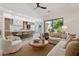 Bright living room with an open layout to the kitchen, creating a welcoming and airy atmosphere at 9265 N 115Th St, Scottsdale, AZ 85259