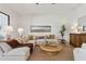 Serene living room featuring a comfortable sectional, ample natural light, and stylish interior design at 9265 N 115Th St, Scottsdale, AZ 85259