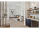 Stunning living area with high ceilings, modern fireplace, and stylish bar area, perfect for entertaining at 9265 N 115Th St, Scottsdale, AZ 85259