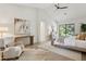 Bright, airy main bedroom featuring a vaulted ceiling, light wood floors, and a glass door to the outdoors at 9265 N 115Th St, Scottsdale, AZ 85259