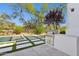 This outdoor grill has a built-in bar with a pool, turf and patio space nearby at 9265 N 115Th St, Scottsdale, AZ 85259