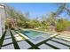 An infinity pool has artificial turf, stone walkways and plenty of desert landscaping at 9265 N 115Th St, Scottsdale, AZ 85259