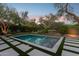 Backyard swimming pool surrounded by lush trees and bushes, fenced in for additional privacy at 9265 N 115Th St, Scottsdale, AZ 85259