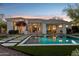 Gorgeous pool and patio, with modern turf and paver design, next to the home's open living spaces at 9265 N 115Th St, Scottsdale, AZ 85259