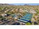 An aerial view featuring the tennis courts, pool, clubhouse, and desert landscaping in the community at 9265 N 115Th St, Scottsdale, AZ 85259
