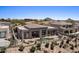 Expansive aerial view of a backyard featuring a pool, patio, and desert landscaping at 9432 N Longfeather --, Fountain Hills, AZ 85268