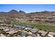 Expansive aerial view capturing the property's serene setting by the lush golf course and desert mountains at 9432 N Longfeather --, Fountain Hills, AZ 85268