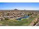 Aerial view of beautiful homes in a golf course community bordering a pond and green at 9432 N Longfeather --, Fountain Hills, AZ 85268