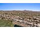 Wide aerial view of sprawling luxury homes in a scenic golf community near a pond at 9432 N Longfeather --, Fountain Hills, AZ 85268