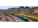 Stunning aerial view of a luxurious home nestled amidst a golf course and mountains in a desert landscape at 9432 N Longfeather --, Fountain Hills, AZ 85268