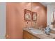 Bathroom with a tiled vanity, and a unique mirror, providing a cozy and functional space at 9432 N Longfeather --, Fountain Hills, AZ 85268