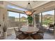 Bright dining area with mountain views, large windows, and a stylish chandelier for elegant meals at 9432 N Longfeather --, Fountain Hills, AZ 85268