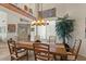 Dining area featuring a wooden table, ample seating, stylish lighting, and adjacent views, perfect for entertaining and everyday living at 9432 N Longfeather --, Fountain Hills, AZ 85268