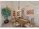 Dining room with a large wooden table and decorative light fixture, perfect for gatherings and meals with Gathering at 9432 N Longfeather --, Fountain Hills, AZ 85268