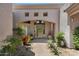 Inviting home entrance featuring stylish architectural details and lush desert landscaping at 9432 N Longfeather --, Fountain Hills, AZ 85268