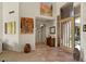 Spacious entryway featuring tile flooring, high ceilings, and unique artwork, creating a welcoming ambiance to the home at 9432 N Longfeather --, Fountain Hills, AZ 85268