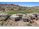 Expansive home featuring desert landscaping surrounded by green golf course and mountainous background at 9432 N Longfeather --, Fountain Hills, AZ 85268