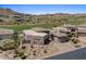 Expansive home featuring desert landscaping surrounded by green golf course and mountainous background at 9432 N Longfeather --, Fountain Hills, AZ 85268