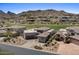 Expansive home featuring desert landscaping surrounded by green golf course and mountainous background at 9432 N Longfeather --, Fountain Hills, AZ 85268