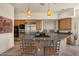 Bright kitchen with wooden cabinets, stainless steel appliances, a spacious island and stylish pendant lighting at 9432 N Longfeather --, Fountain Hills, AZ 85268