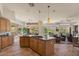 Open-concept kitchen flows into a living space, offering tiled floors and natural light at 9432 N Longfeather --, Fountain Hills, AZ 85268