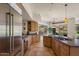 Bright kitchen featuring stainless steel appliances, wooden cabinets, a center island, and a scenic view at 9432 N Longfeather --, Fountain Hills, AZ 85268