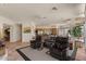 Spacious living area features tile flooring, comfortable seating, an open floorplan, and ample natural light, enhancing the home's appeal at 9432 N Longfeather --, Fountain Hills, AZ 85268