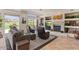 Comfortable living room featuring a fireplace, expansive windows with landscape views and tasteful decor and furnishings at 9432 N Longfeather --, Fountain Hills, AZ 85268