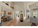 Open-concept living room with high ceilings, fireplace, and access to the outdoor area, providing natural light and views at 9432 N Longfeather --, Fountain Hills, AZ 85268