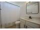 Cozy bathroom featuring a shower with curtain, framed mirror, and tile floors at 9813 W Mcrae Way, Peoria, AZ 85382