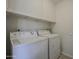 Laundry room area with washer and dryer, and storage space at 9813 W Mcrae Way, Peoria, AZ 85382