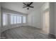Spacious main bedroom with bay windows and plantation shutters at 9813 W Mcrae Way, Peoria, AZ 85382