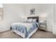 Bright bedroom featuring soft carpet, a comfortable bed, and a mirrored nightstand at 9922 E Thunderbolt Ave, Mesa, AZ 85212