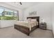 Cozy bedroom with a large window, comfortable bed, and neutral color palette at 9922 E Thunderbolt Ave, Mesa, AZ 85212