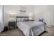Relaxing bedroom featuring soft colors, plush bedding, and bedside tables at 9922 E Thunderbolt Ave, Mesa, AZ 85212