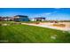 Attractive community center and green space featuring manicured lawns and community buildings at 9922 E Thunderbolt Ave, Mesa, AZ 85212