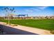 Well maintained community park featuring a large grassy field, playground and sidewalk at 9922 E Thunderbolt Ave, Mesa, AZ 85212