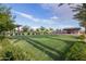 Community space with a lush green lawn, open pavilion, and seating for gatherings at 9922 E Thunderbolt Ave, Mesa, AZ 85212