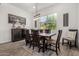 Dining area with natural light, wood floors, and stylish decor at 9922 E Thunderbolt Ave, Mesa, AZ 85212