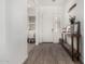 Bright foyer with wood-look tile flooring and a decorative console table at 9922 E Thunderbolt Ave, Mesa, AZ 85212