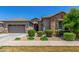 Charming single-story home with manicured landscaping and a two-car garage at 9922 E Thunderbolt Ave, Mesa, AZ 85212