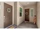 Inviting covered porch featuring a double front door with decorative wreaths at 9922 E Thunderbolt Ave, Mesa, AZ 85212