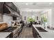Open kitchen showcases stainless steel appliances, gas range, and a view to the backyard at 9922 E Thunderbolt Ave, Mesa, AZ 85212